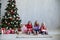 Three girls opens Christmas presents new year Christmas tree Garland