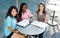 Three girls outside studying