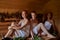 Three girls relaxing in sauna