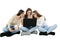 Three girls sitting on the ground, crosslegged, holding laptop