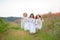 Three girls spending time together in the summer field