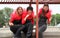 Three girls standing on roof