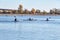 Three girls are swimming in sports kayaks