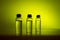 Three glass corked bottles filled with liquid. Background for science and medicine. Virus vaccine