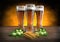 Three glasses of beer with barley and hops - 3D render