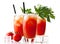 Three glasses of bloody mary with ice cubes & tomatoes on white