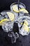 Three glasses with fresh cold carbonated water with lemon slices and ice cubes closeup