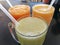 Three glasses of freshly squeezed juice with tubes. Delicious, nutritious and healthy drinks