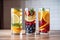 three glasses of fruit-infused water, each with a different combination of fruits and flavors