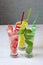 Three glasses with various soft drinks to quench your thirst on a hot summer day, watermelon, mint and lemon drinks with