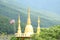 Three gloden pagoda and Thailand flag at Phra Phutthabat Pha Nam temple in Tak