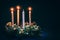 Three golden advent candles burning religious concept