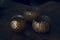 Three golden ornamental candle holders wiith copy space against dark background
