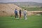 Three golfers walking on green, Laguna Niguel, CA