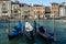 Three gondolas covered and tied-up on Grand Canal in Venice