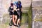 Three gothic girls wearing leather dress street style