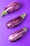 Three graffiti eggplants