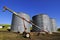 Three grain silos by the farmfield