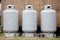 Three gray propane tanks