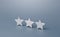 Three gray stars. Rating evaluation concept. Service quality. Buyer feedback. High satisfaction. Good reputation status