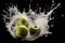 Three green apples splashing in water against a black background, with water droplets in focus