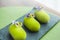 Three green mousse cakes covered with velvet glaze