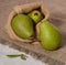 Three green pear rustic style fruit fresh flax burlap organic