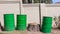 Three Green Steel Barrel Bins Outdoor