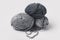 Three grey yarn balls
