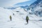 Three guides hiking up the Matanuska Glacier. Trekking on white ice of a valley glacier in remote Alaska