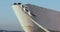 Three gulls sitting on rope. ship stands near pier. ship sway on waves