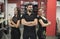 Three hairdressers posing in barber shop