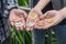 three hand of Young men holding up golden, silver, copper bitcoin. Focus of bitcoin in open hand