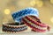 Three handmade homemade natural woven bracelets of friendship in magic christmas lights reflections