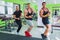 Three handsome athletic men posing at gym