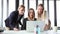 Three happy businesswoman with laptop, high-fiving and cheering