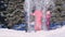 Three happy kids throwing snow in the air at once