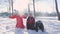 Three happy kids throwing snow in the air at once