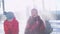 Three happy kids throwing snow in the air at once