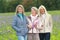 Three happy mature girlfriends - exterior shot