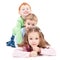 Three happy smiling kids lying on pile stack.