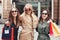 Three Happy Woman Walking On The Street After Shopping Proces