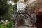 Three headed dragon made of bronze with glass ball in their mouth on the top of the antique incense burner at Temple of Literature