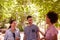 Three healthy friends laughing and chatting