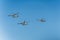 Three helicopters flying on a clear day at a military parade rehearsal. War copter and equipment used in army. Apache