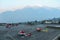 Three helicopters on the runway at dawn in Himalayas