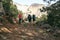 Three hikers on trail in mountains