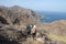 Three hikers on a trail in the north of La Gomera, Canary Islands