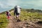 Three hikers walking in the mountains