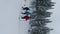 Three Hikers Walking Quickly In Snowshoes In The Snow